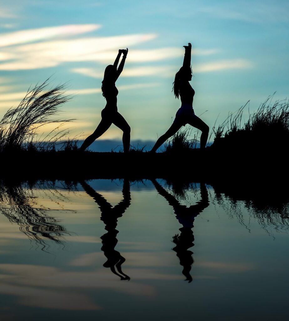 women, yoga, silhouettes, water, reflection, mirroring, water reflection, pose, posing, yoga pose, meditation, stretching, wellness, well-being, exercise, adults, asia, girls, morning, outdoors, pair, people, stance, nature, sunrise, sunset